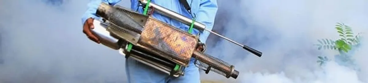 Fumigation technician using a fogger for deep pest treatment in Jacksonville, FL